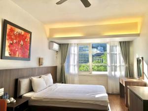 Postel nebo postele na pokoji v ubytování Star Hotel - Khách sạn Ngôi Sao