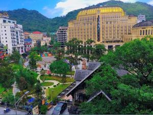 an overhead view of a city with buildings and trees at Star Hotel - Khách sạn Ngôi Sao in Tam Ðảo