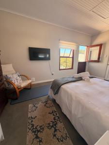 Postel nebo postele na pokoji v ubytování Teal Tides