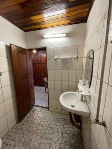 a bathroom with a sink and a mirror at Couba Club in Douala +48 photos