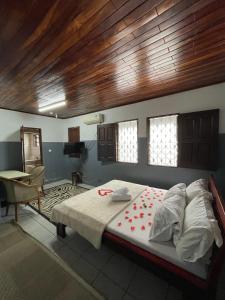 a bedroom with a bed and a desk in it at Couba Club in Douala
