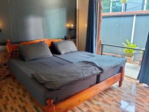 Postel nebo postele na pokoji v ubytování Summer Club2 Hostel and Cafe Aonang