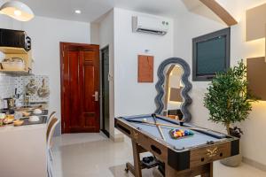 a room with a pool table in it at Ori Home in Ho Chi Minh City