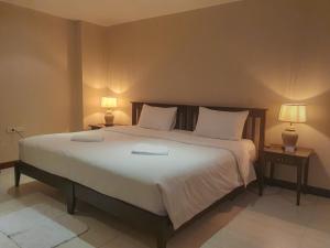 Postel nebo postele na pokoji v ubytování Townhouse PK Garden + 59 fotografií