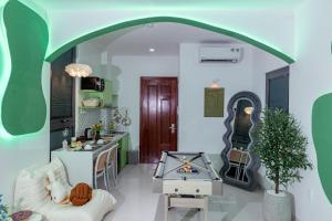 a living room with an archway and a table at Ori Home in Ho Chi Minh City