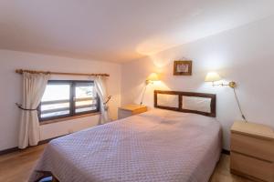 Ένα ή περισσότερα κρεβάτια σε δωμάτιο στο L'Alpazen Jouve Duplex +15 φωτογραφίες