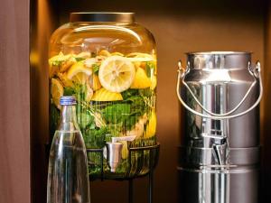 a glass jar filled with food and a blender at B&B Hotel Augsburg-West in Augsburg