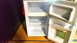 an empty refrigerator with its door open in a room at Minamikoma-gun - House - Vacation STAY 19040 in Kajikazawa
