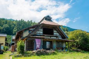an old house sitting on top of a field at Minamikoma-gun - House - Vacation STAY 19040 in Kajikazawa