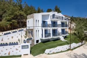 an aerial view of a white house with a yard at Ifigeneia Premium Villa in Limenaria