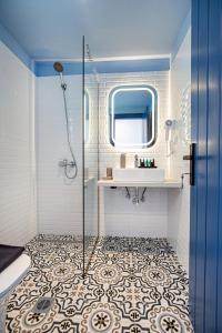 a bathroom with a sink and a shower at Ifigeneia Premium Villa in Limenaria +119 photos