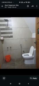 Ванная комната в Mullassery H Stay