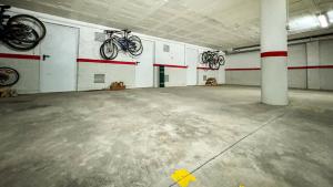 two bikes hanging on the wall of a garage at Cal Fontcitrana, casa de montaña in Llivia