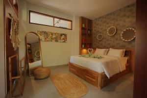 Ένα ή περισσότερα κρεβάτια σε δωμάτιο στο Indira villa