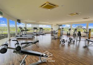 a gym with treadmills and exercise equipment in a building at Nature Home - Swiss Garden Resort Residences - Weekend Free Breakfast in Kuantan