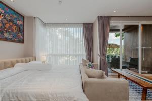 Ένα ή περισσότερα κρεβάτια σε δωμάτιο στο Beachfront Luxury 1R Condo near Marriot Naiyang 50 2 +85 φωτογραφίες