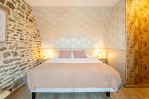 Postel nebo postele na pokoji v ubytování Gîte Le Penty