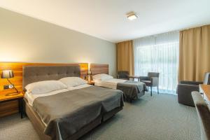 Postel nebo postele na pokoji v ubytování Apartamenty przy Latarni + 53 fotografií