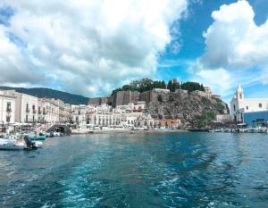 a view of a city from a boat in the water at Villa Sea Rose in Lipari +27 photos