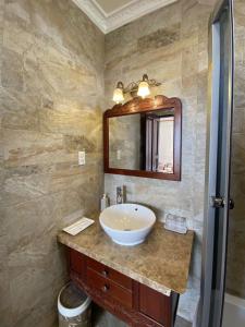 a bathroom with a sink and a mirror at Diamond Hotel in Da Lat +24 photos