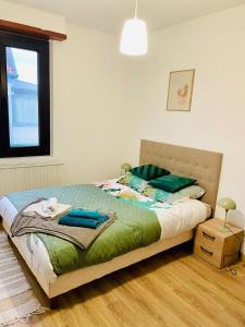 Ένα ή περισσότερα κρεβάτια σε δωμάτιο στο Chez Côme - Le confort aux portes de Strasbourg