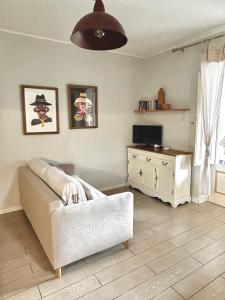 a living room with a couch and a dresser at Villa Sea Rose in Lipari