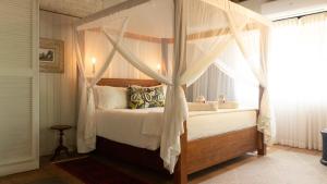 Ένα ή περισσότερα κρεβάτια σε δωμάτιο στο Vida Nova Kruger