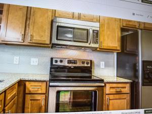 Kuchyň nebo kuchyňský kout v ubytování Oasis Retreat237 + 2 fotografie