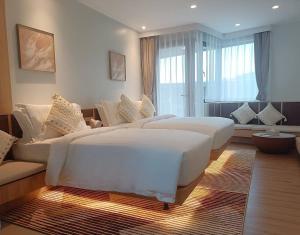 Postel nebo postele na pokoji v ubytování Wyndham Garden Samui Wing + 40 fotografií