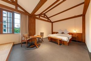 Una cama o camas en una habitación de shanjue Humanities MeiSu(changjiang cabieway Branch) 55 fotos más