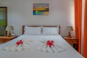 Ένα ή περισσότερα κρεβάτια σε δωμάτιο στο Yvon's Tropical Villa