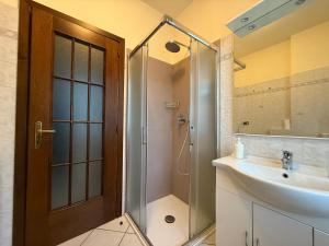 a bathroom with a shower and a sink at Casa Alpina - Aosta in Aosta +16 photos