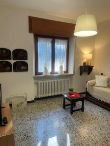 a room with a bed and a table and a window at B&b Cristina - Appartamento Monte Coccia in Campo di Giove +17 photos