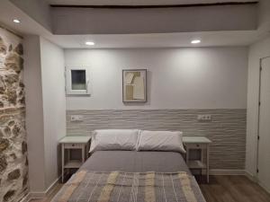 En eller flere senge i et værelse på Casa del siglo XV 3 Privada con Baño + 21 billeder