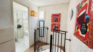 a bathroom with a walk in shower next to a toilet at Appartement Cocody 215 LUMIO in Lumio +16 photos