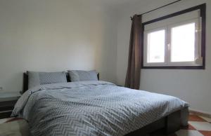 En eller flere senge i et værelse på F5 Familial avec Emplacement Top à Akid Lotfi