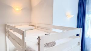 a white bunk bed in a room with a window at Liam Leo Suite by Ca-Sa Check in Chioggia