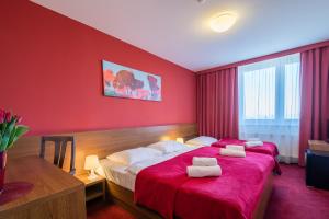 Posteľ alebo postele v izbe v ubytovaní Hotel Slovan