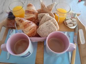 a tray of bread and two cups of coffee at escapade coeur provence in La Celle