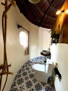a bathroom with a toilet in a room at Tam Coc Sora - Traditional Home - Center in Vũ Lâm