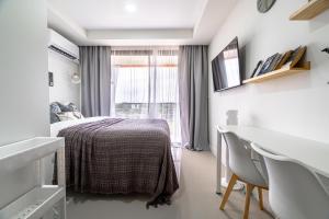 En eller flere senge i et værelse på North Gate Apartments + 21 billeder