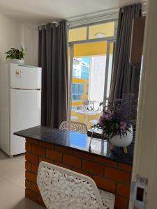 Køkken eller tekøkken på Casa Da Praia Apart Hotel