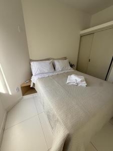 En eller flere senge i et værelse på Casa Da Praia Apart Hotel + 12 billeder