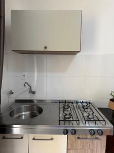 Køkken eller tekøkken på Casa Da Praia Apart Hotel