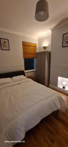 Postel nebo postele na pokoji v ubytování Dartford Haven