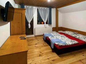 Postel nebo postele na pokoji v ubytování Penzion a restaurace U Zvonku