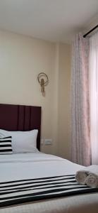 Postel nebo postele na pokoji v ubytování Lake View House- Shawmut Nakuru