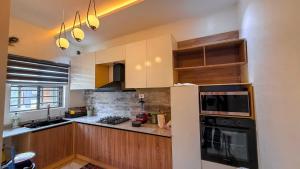 Η κουζίνα ή μικρή κουζίνα στο Nex Home Apartment