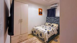 Ένα ή περισσότερα κρεβάτια σε δωμάτιο στο Nex Home Apartment