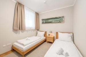 Ένα ή περισσότερα κρεβάτια σε δωμάτιο στο Mountain Paradise Apartments - by myNests